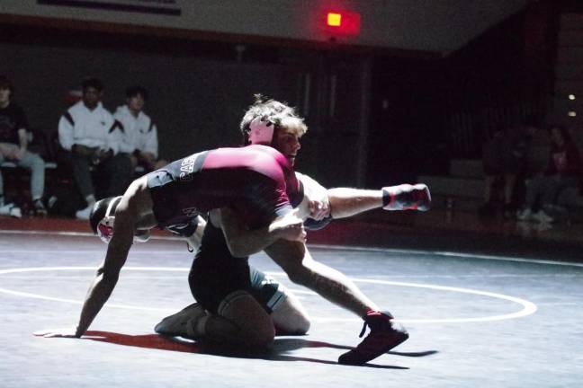 Pompton Lakes' Joseph Aungst, left, takes on Wallkill Valley's Owen Crowell in the 150-pound weight class. Aungst won by decision, 7-0. (Photos by George Leroy Hunter)