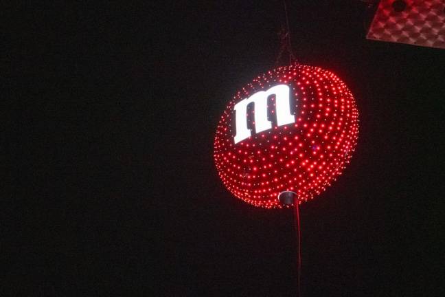 A red M&amp;M with 1,000 lights was lowered at midnight Monday, Jan. 1 in Hackettstown to celebrate the new year. The U.S. headquarters of Mars Wrigley, which makes M&amp;Ms, is based in Hackettstown as well as in Newark. (Photos by Nancy Madacsi)