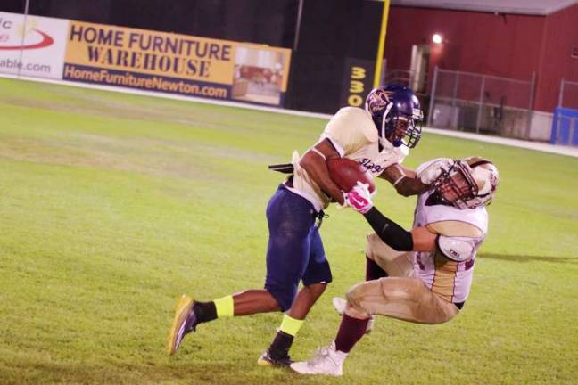 Sussex Stags stomp the Plattsburgh NorthStars Sussex Stags kick returner Mannie Stewart stiff arms Plattsburgh Northstars linebacker Garren Arnold.