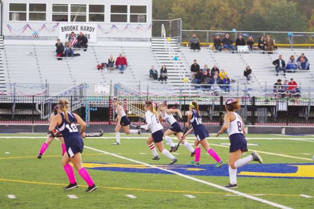 Jefferson tops Pope John in field hockey The ball and the players in motion.
