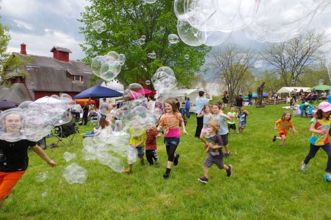 Dozens of children spent much of the day chasing bubbles at Lusscroft Farm&#xfe;&#xc4;&#xf4;s 8th Annual Medicine Wheel Festival and Community Garden Celebration.