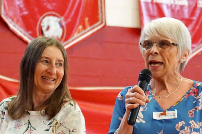 On right, Linda Miller Kinney says she and her high school sweetheart will be married 50 years on October. Kathy Sienko Keba listens on left.