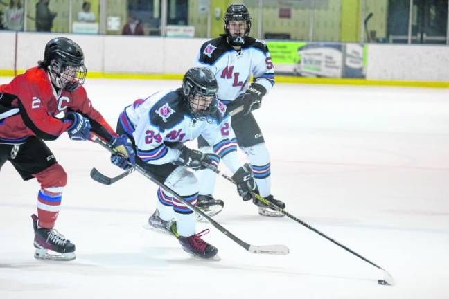 Junior Tanner Gaboda (24) of N/LV handles the puck.