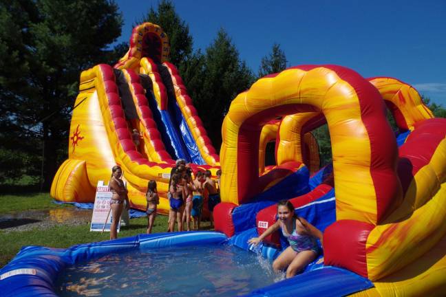 The inflatable water slides were the most popular and fun part of the day at the Skylands Stadium Summer Fest Backyard Beach Bash.