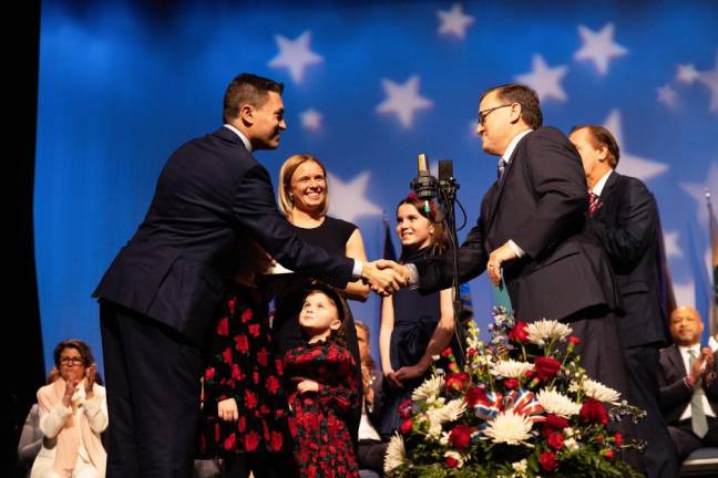 Mike Inganamort, left, is congratulated after taking the oath of office as a state Assembly member representing District 24.