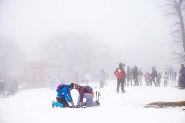 Lacing up snowshoes before the race.