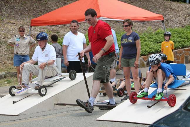 Cub Scout pack hosts annual mobile derby Bob Allen takes on Cooper Weeks.