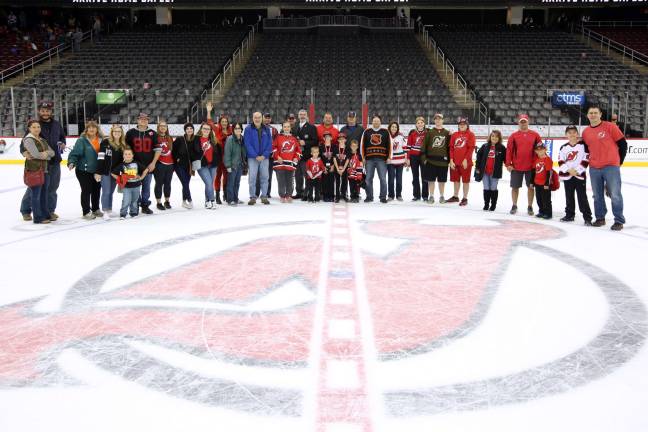 In 2016, the Jefferson Township Recreation bus trip attendees posed for a group photo with resident and NHL referee Steve Meyer at center ice at the Prudential Center, where they saw the Devils vs. Tampa Bay game.
