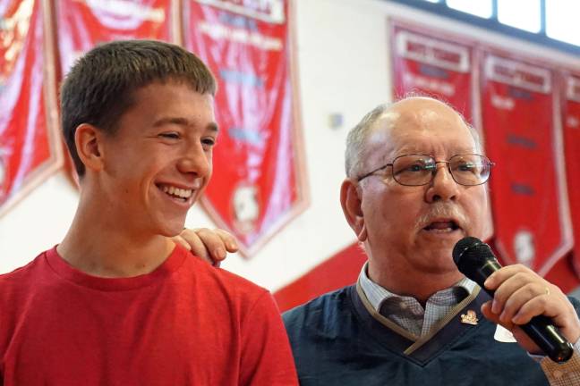 From right, Joe Rosselli encourages 2017 Class President Dan Banas to bring his class together in 50 years.