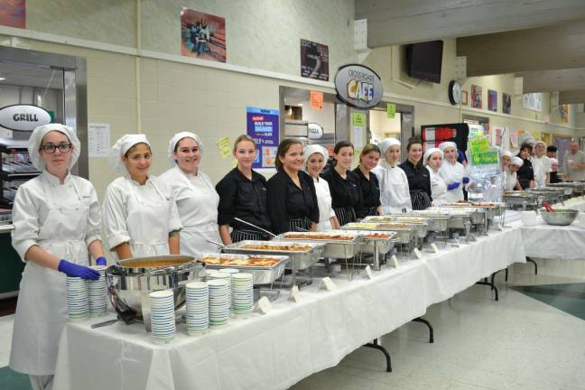 Sussex Tech hosts annual game dinner The culinary students line up to start serving their guests.