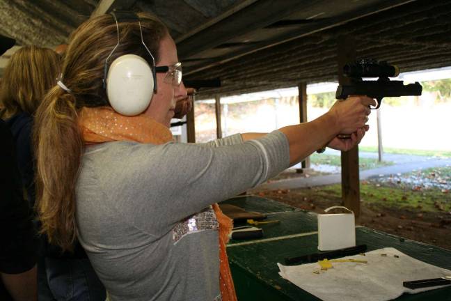 Franklin Revolver and Rifle Association hosts training First-place shooter Stephanie Monroe fires from an isosceles stance position. As a novice, she scored a 95, 97 and 98 out of a possible 100 points.