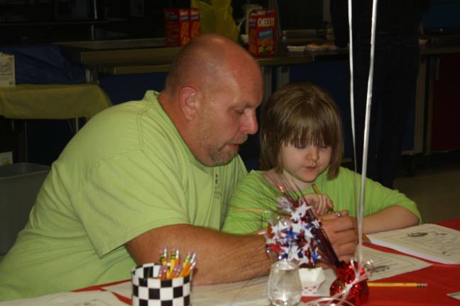 Maya and her dad read their Mad Libs stories to each other.