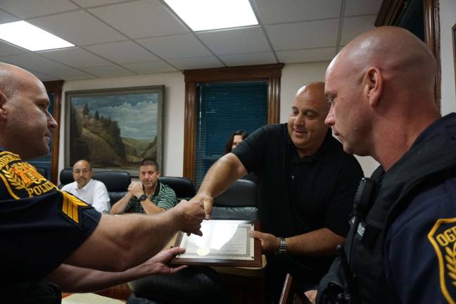 Ogdensburg officers honored for saving woman's life Sergeant Stephen Gordon, left, receives a plaque from Ogdensburg Mayor Steve Ciasullo with Patrolman Christopher Geene.