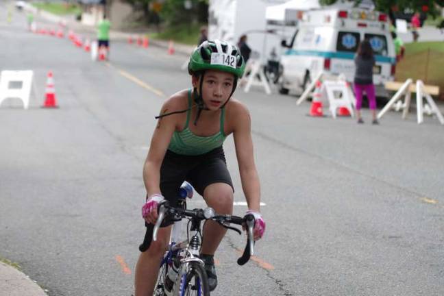 Swim, cycle, run Hannah Calderon, 11, of Newton, finished in 6th place in the female 19 and under category with an overall time of 1:46:33.26.