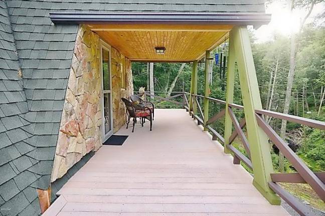 One-of-a-kind retreat on 13+ acres with trout stream Deck