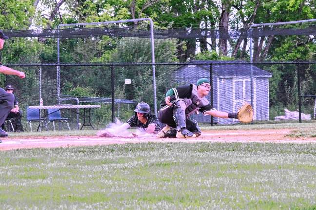 Photos: Rangers advance to semifinal Wallkill Valley runner Chris Collins slides safe onto home plate to score in the second inning of the game against New Milford on Thursday, May 29. The Rangers won, 10-0, and advance to the semifinal round of the NJSIAA North Jersey, Section 1, Group 1 tournament Tuesday, June 3 at Pequannock. (Photos by George Leroy Hunter)
