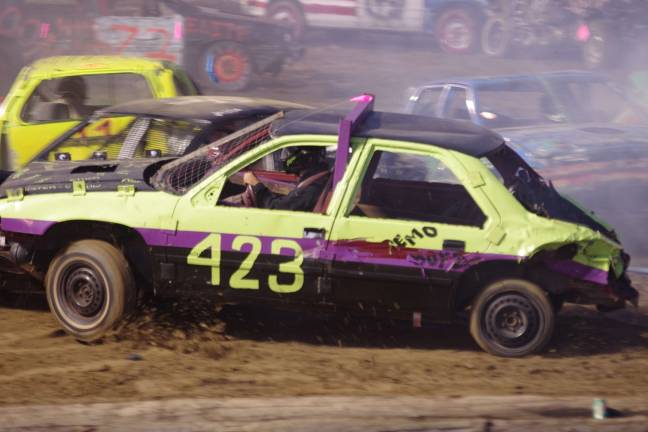 Tony Alexander of Sussex Boro, New Jersey holds his own in his little car in the demolition derby. Alexander finished in first place in the compact heat category.