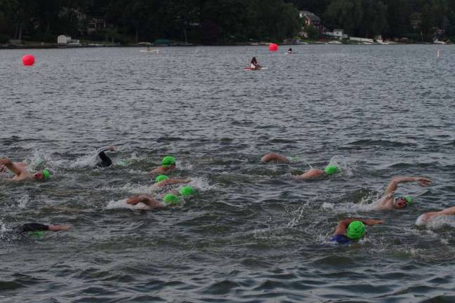 Swim, cycle, run Athletes tackle the half mile swim.