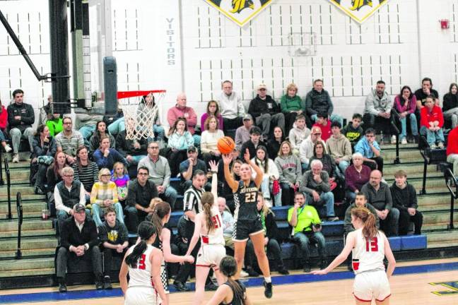 Jefferson's Grace Weihmiller (23) releases the ball during a long-range shot. She scored five points.