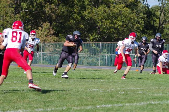 Wallkill Valley running back Dylan Harlos advances the ball through an opening in the Lenape Valley defense.