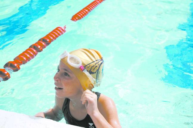 Volunteer group hosts swim-a-thon Seven-year-old simmer Ella Duphiney swam 32 laps.