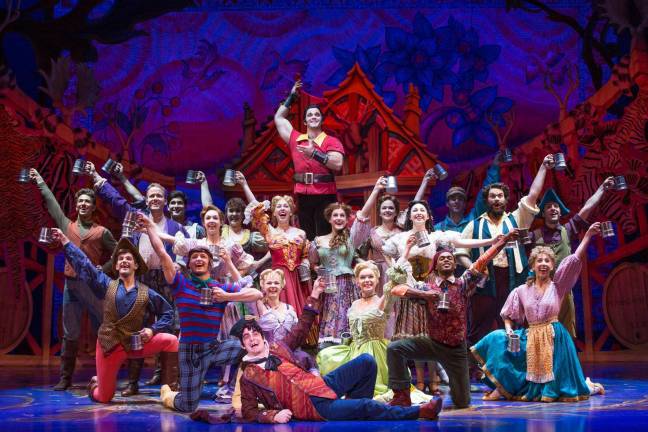 Photo credit Matthew Murphy Cameron Bond as Gaston and the cast of Disney's &quot;Beauty and the Beast.&quot;
