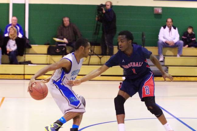 SCCC falls in basketball showdown Sussex County's Kahlil Stewart dribbles the ball as Brookdale's Corrie Brown reaches in to try to steal it.