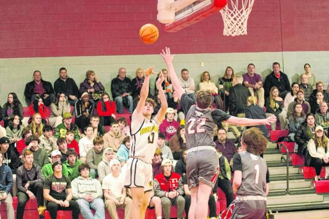 West Milford's Ognjen Ljusic launches the ball from afar. He scored 14 points.