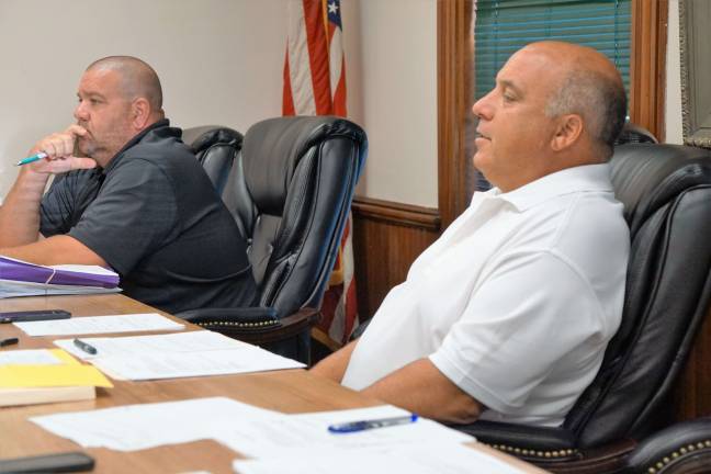 From left, Councilman Robert McGuire and Mayor Steve Ciasullo discuss ordinances with Attorney William E. Hinkes.