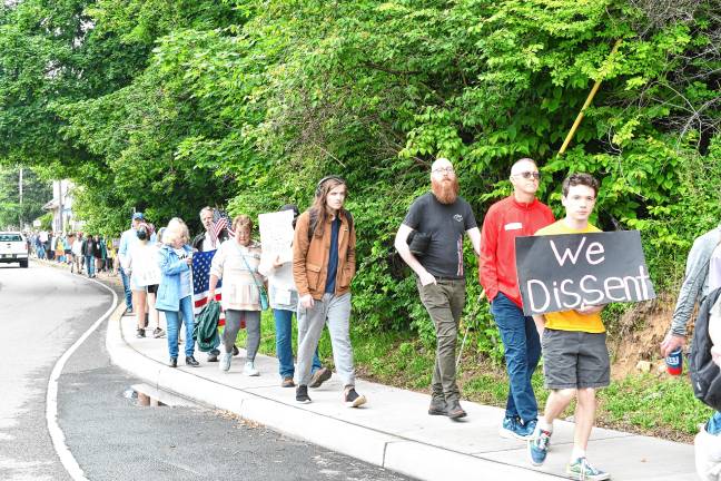 ‘We believe in hope’ Residents march through Newton after a ‘No Kings’ protest Saturday, June 14 at the Newton Green. (Photos by Maria Kovic)