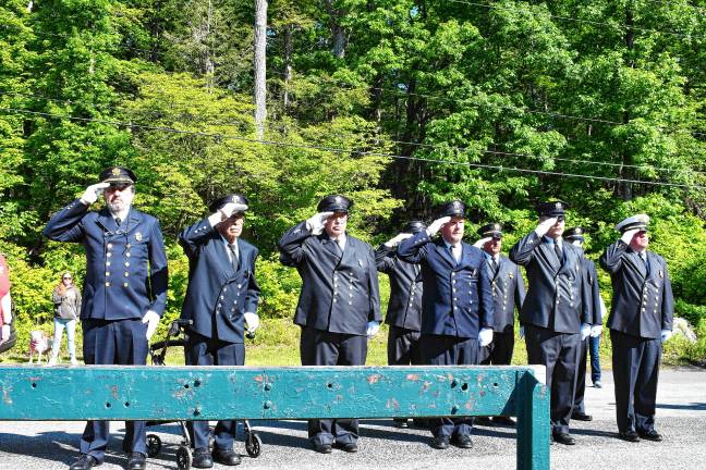 Photos: Memorial Day service in Ogdensburg Fire Department officials salute during the service.