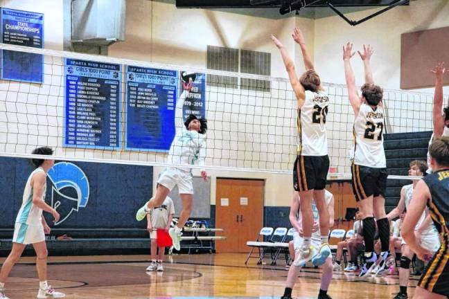 Sparta's Joshua Tolentino gets a hand on the ball to strike it. He was credited with 11 kills and four aces.