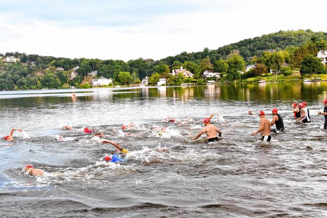 Photos: Pass it Along’s 14th annual Triathlon Pass it Along’s 14th annual Triathlon begins with the swim course Saturday, July 26 in Lake Mohawk in Sparta.