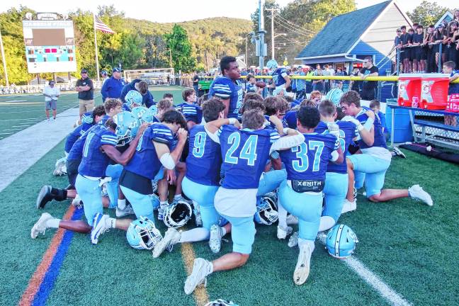 High Point remains undefeated <b>The Spartans huddle up before the start of the game.</b>