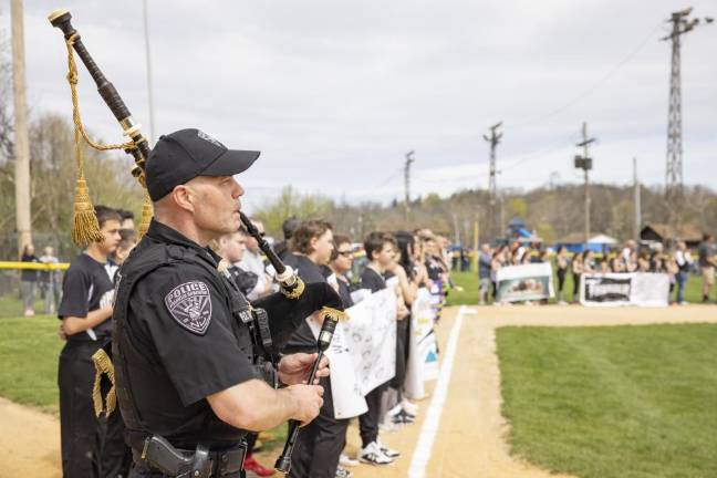 Franklin Officer Jeff Korger Playing National Anthem on bagpipes