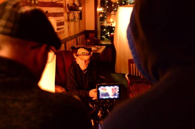 Talking to filmmaker Kevan Ali Actor Terry Michael Clarke, left, and director Kevan Ali watch as actor Bill McInerney is about to perform his scene.