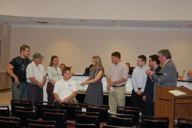Erica Klemens, chairwoman of the Morris County Young Republicans presents a check to Sgt. Aaron Alonso at a Jefferson Township Council meeting. With her are Gary La Spisa, treasurer, Tom Strowe, member, and Jordan Chester, secretary. The funds were raised by a &quot;Backyard Barbeque&quot; held last month by the Young Republicans. Mayor Russell Felter is shown at the right.