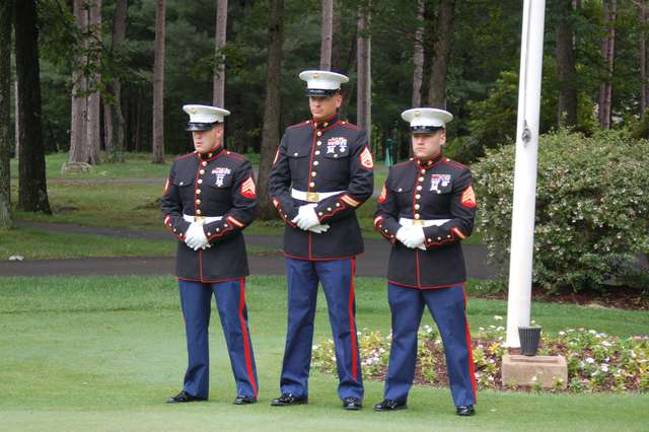 Alonso Strong Golf Outing hosts fundraiser Standing at ease are Marine Sergeants Samuel Moorehead, Louis Serafin and Fernando Fuentes after raising the Flag at the Alonso Strong Golf Outing to start play.