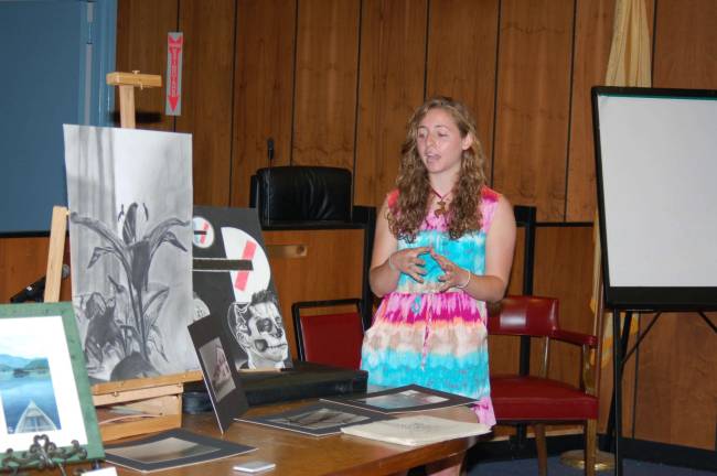 Jessica Arena, guest artist, speaks to the student artists and the audience about how she became an artist and the type of work she produces. She also is a graduate of Jefferson Township High School,class of 2007. She is a substitute art teacher at the Middle School.
