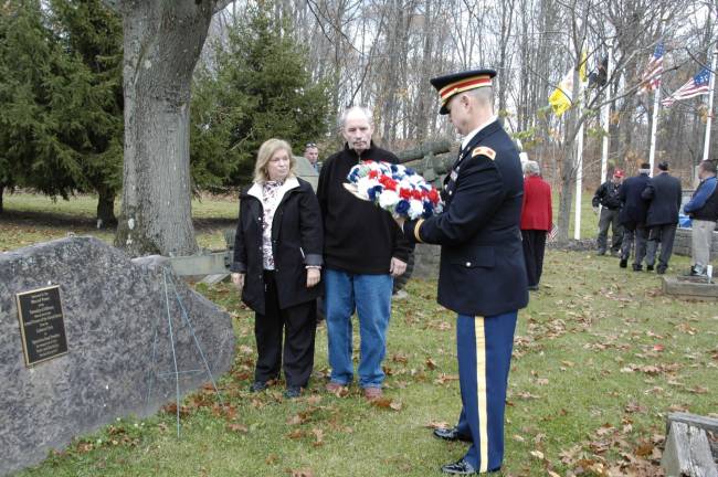 Mr. and Mrs John Wroblewski and Colonel Scott Turner, Jr. are shown placing a wreath at the Memorial to those who served the U.S. from the Lebanon Crisis to Operation Iraqi Freedom.