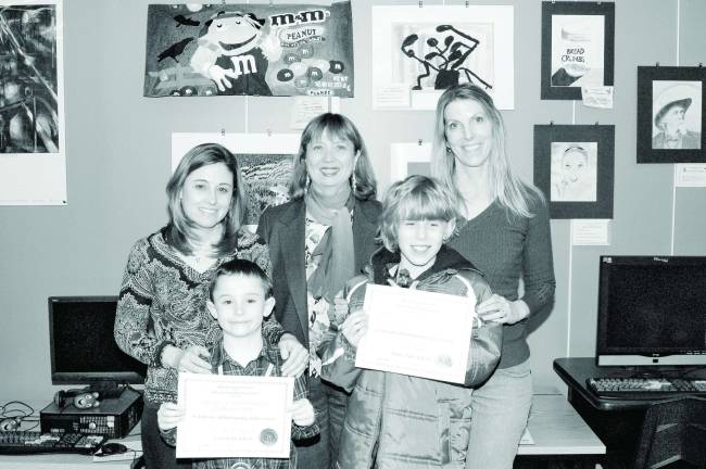 The Student Artists of the Month from Cozy Lake School and the White Rock Lake School are shown with their parents during the presentations. Pictured from left: Mrs. Clarkson with her son Colby, Kathleen Weir, Art Teacher and Mrs. Woelfel with her son Max.