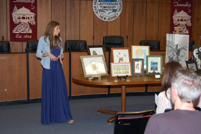 Student atwork showcased in council chamber Katie Della Terzo, guest artist, describes the art work that she produces in her studio. She is a graduate of Jefferson Township High School,class of 2008. She is also a substitute art teacher in the Middle School.