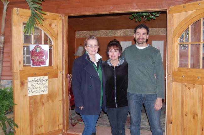 Photo provided Winner Be Schroeder of Lords Valley, Pa. with George and Frances Delgado, owners of George's Wine &amp; Spirits Gallery, Branchville, who designed and furnished the donated shed.
