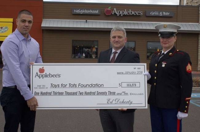 From left, Shimon Peretz, general manager, Applebee&#x2019;s of Clark; Colonel Ted Silvester, United States Marine Corps (Ret) and vice president of marketing and development, Toys for Tots; Staff Sergeant Stacey Van Liera, United States Marine Corps.
