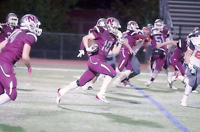 Newton ball carrier Ryan Pappas is on the move during an 88-yard kickoff return for a touchdown in the second quarter (Photo by George Leroy Hunter)