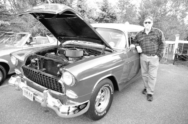 Classic cars cruise into Branchville Ken Smith of Wantage with his 1955 Chevy Belair.