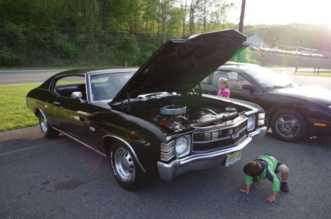 Classic cars cruise into Branchville Youngsters check out a 1971 Chevy Chevelle.