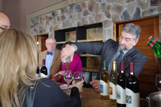 Mark Cacace of Wantage&#x2019;s Ventimiglia Vineyard is shown serving a glass of white wine to a visitor. The winery&#x2019;s offerings seemed to be very much appreciated, especially their dry white wine.