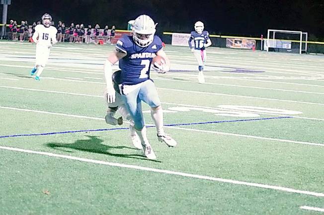 Sparta wide receiver James Maloney gains a few yards after catching the ball in the second quarter. Maloney made three receptions for 102 yards resulting in one touchdown. (George Leroy Hunter)