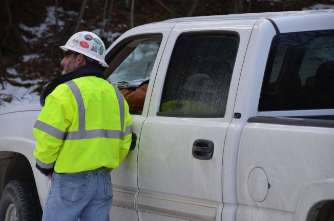 Photo by Daniel Fitzsimmons Tennessee Gas employees in Montague on Friday.